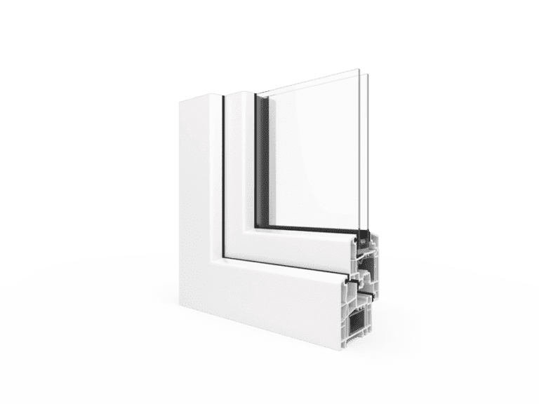 A white window-frame cross-section is shown at an angle with a clear glass panel rising from it. The exposed right edge reveals several internal chambers and dark seals within the white profile. The sample sits on a pale ground against a muted green background.